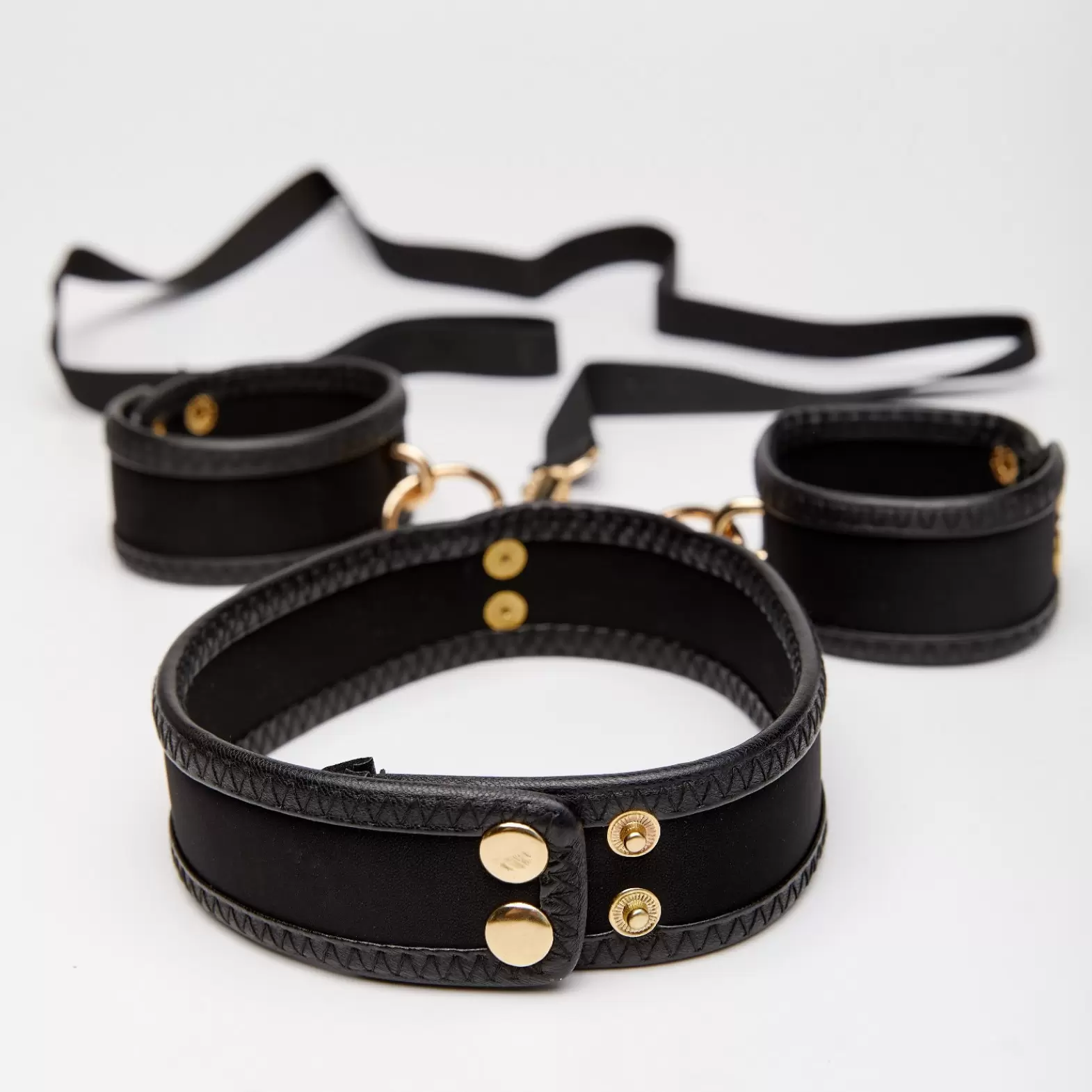Set of handcuffs and collar with leash