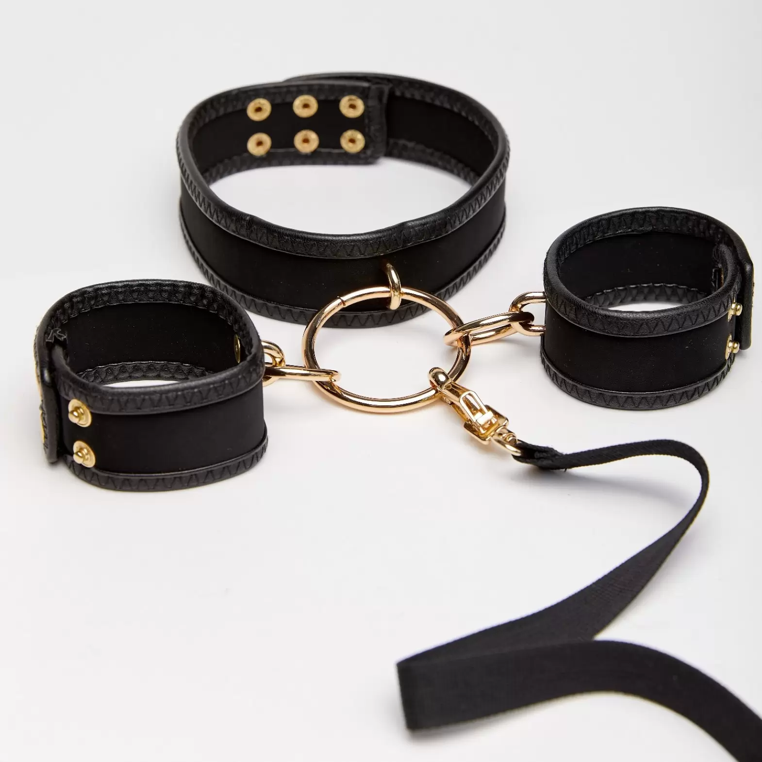 Set of handcuffs and collar with leash