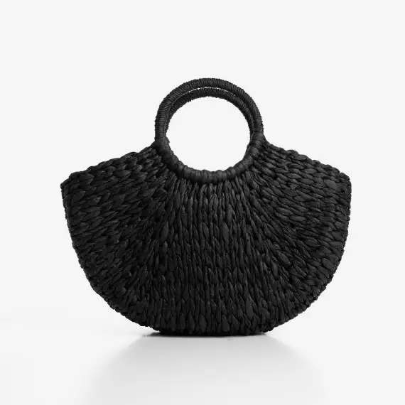 The beach bag from straw is black