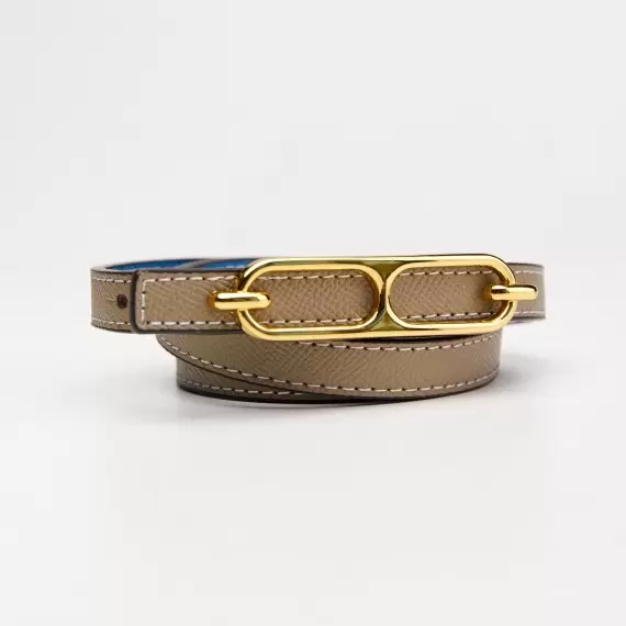 Leather belt for women's pants with a light beige metal buckle